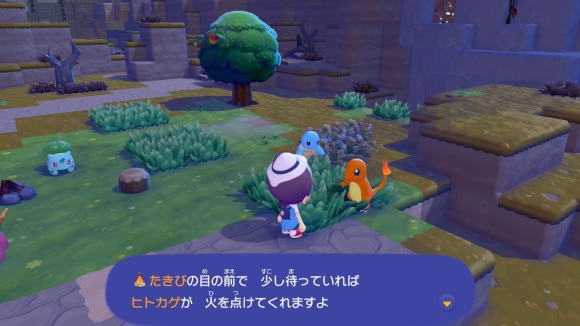 たき火の近くで待機する